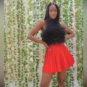 Red pleated faux leather skirt, worn once for photoshoot